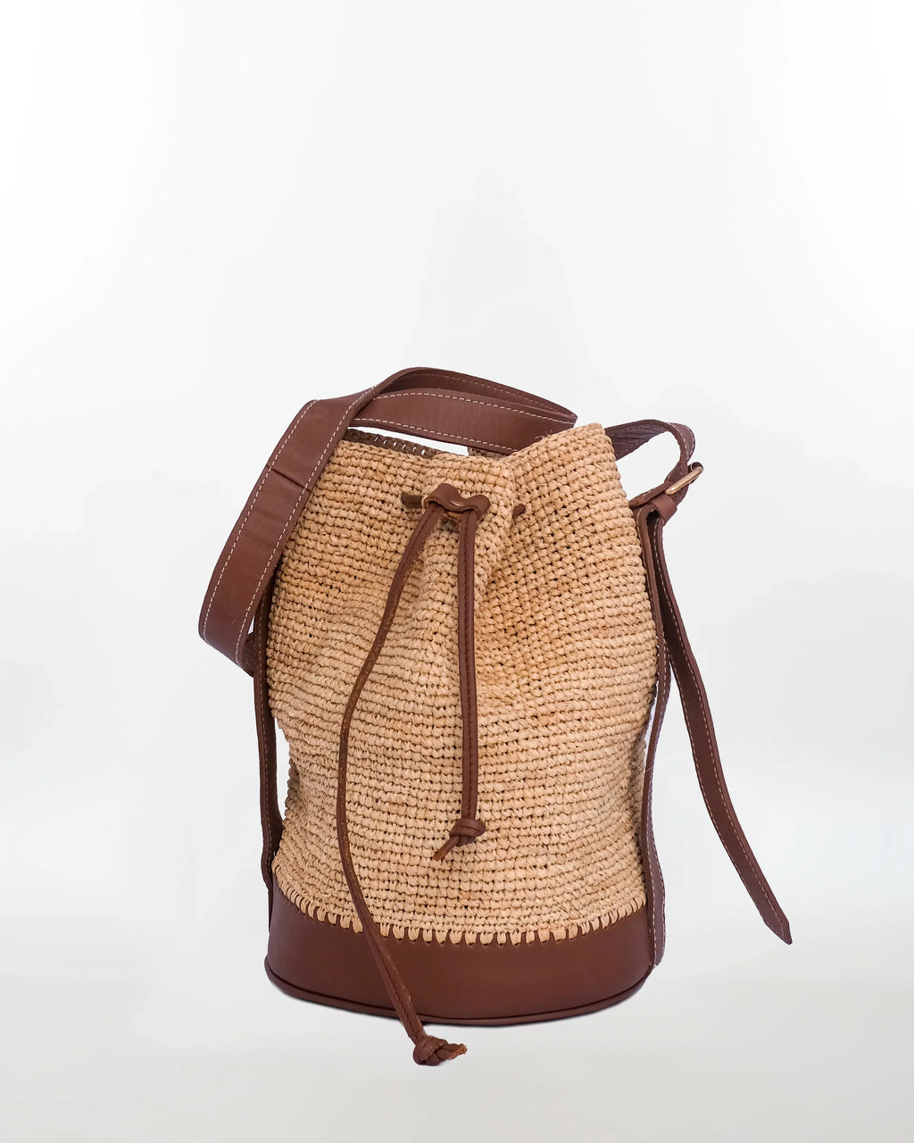 Jemure Handwoven Raffia Bucket Bag with Leather Base & Drawstring Closure – Natural